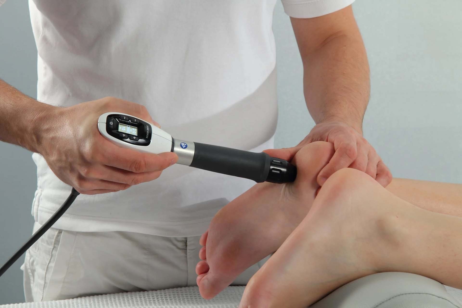 Practitioner delivering radial shockwave therapy to a patient's heel with a Storz Medical applicator at Lovejoy Chiro & Med Spa in Allen, TX